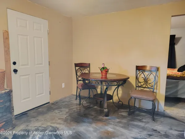 a room with water heater and stairs