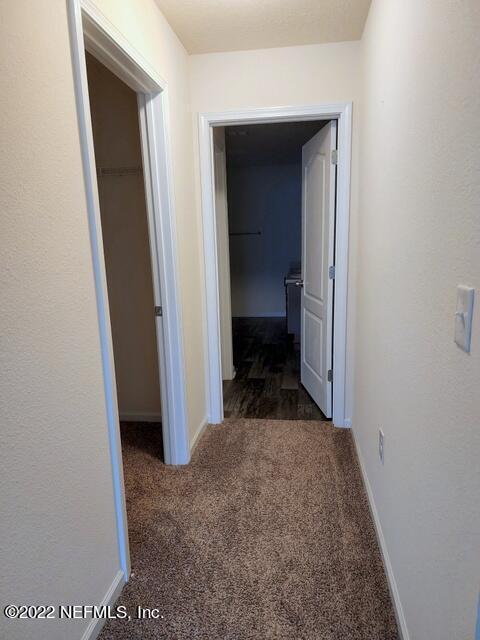 4295 Packer Meadow Way Middleburg, FL 32068 - Photo 11 of 26 a view of a room that has a bed in it