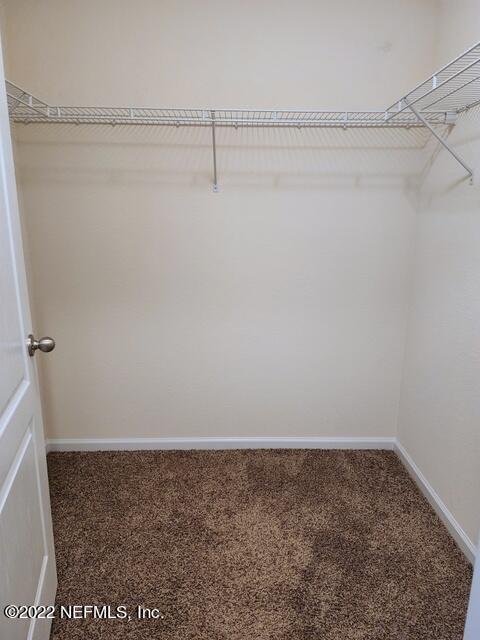 4295 Packer Meadow Way Middleburg, FL 32068 - Photo 12 of 26 a view of a room with racks on the wall