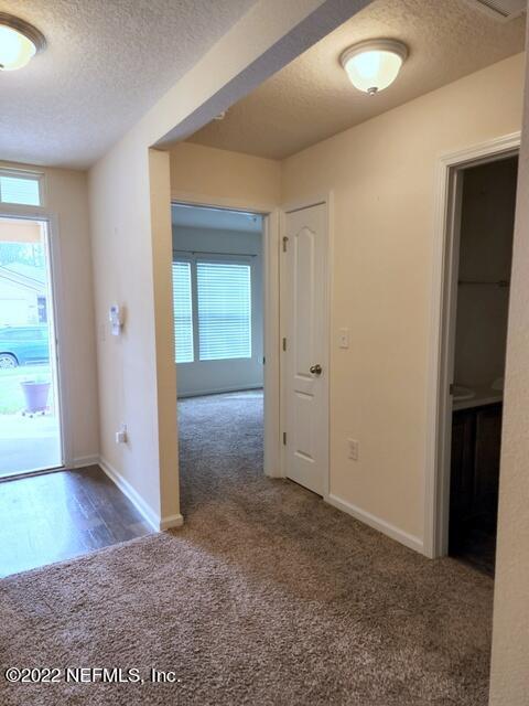 4295 Packer Meadow Way Middleburg, FL 32068 - Photo 17 of 26 an empty room with wooden floor