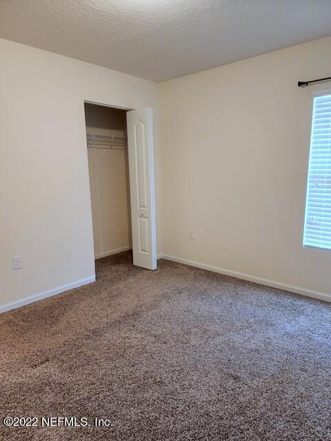 4295 Packer Meadow Way Middleburg, FL 32068 - Photo 23 of 26 a view of an empty room and a window