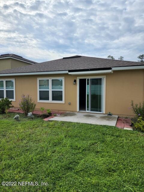 4295 Packer Meadow Way Middleburg, FL 32068 - Photo 25 of 26 a house view with a garden space