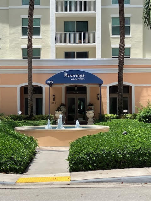 802 West Windward Way, Unit 204 Lantana, FL 33462 - Photo 1 of 29 a front view of a building with garden