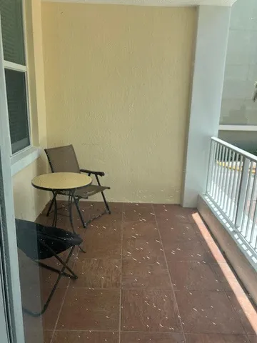 a view of a room with a table and chair