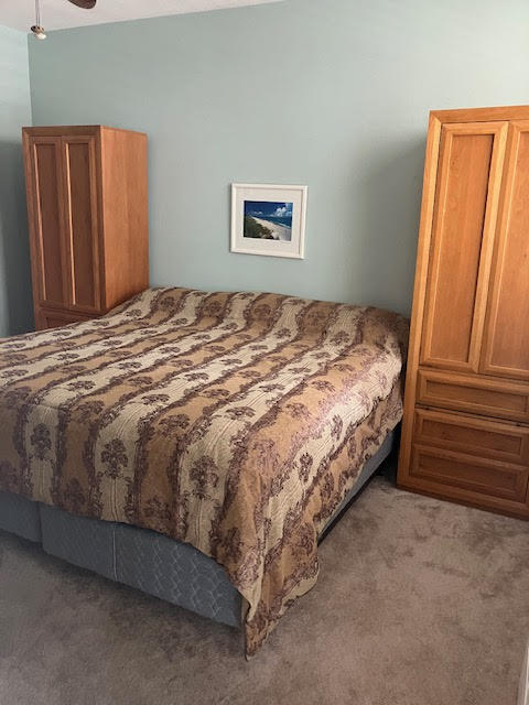 802 West Windward Way, Unit 204 Lantana, FL 33462 - Photo 22 of 29 a bed sitting in a bedroom next to a window