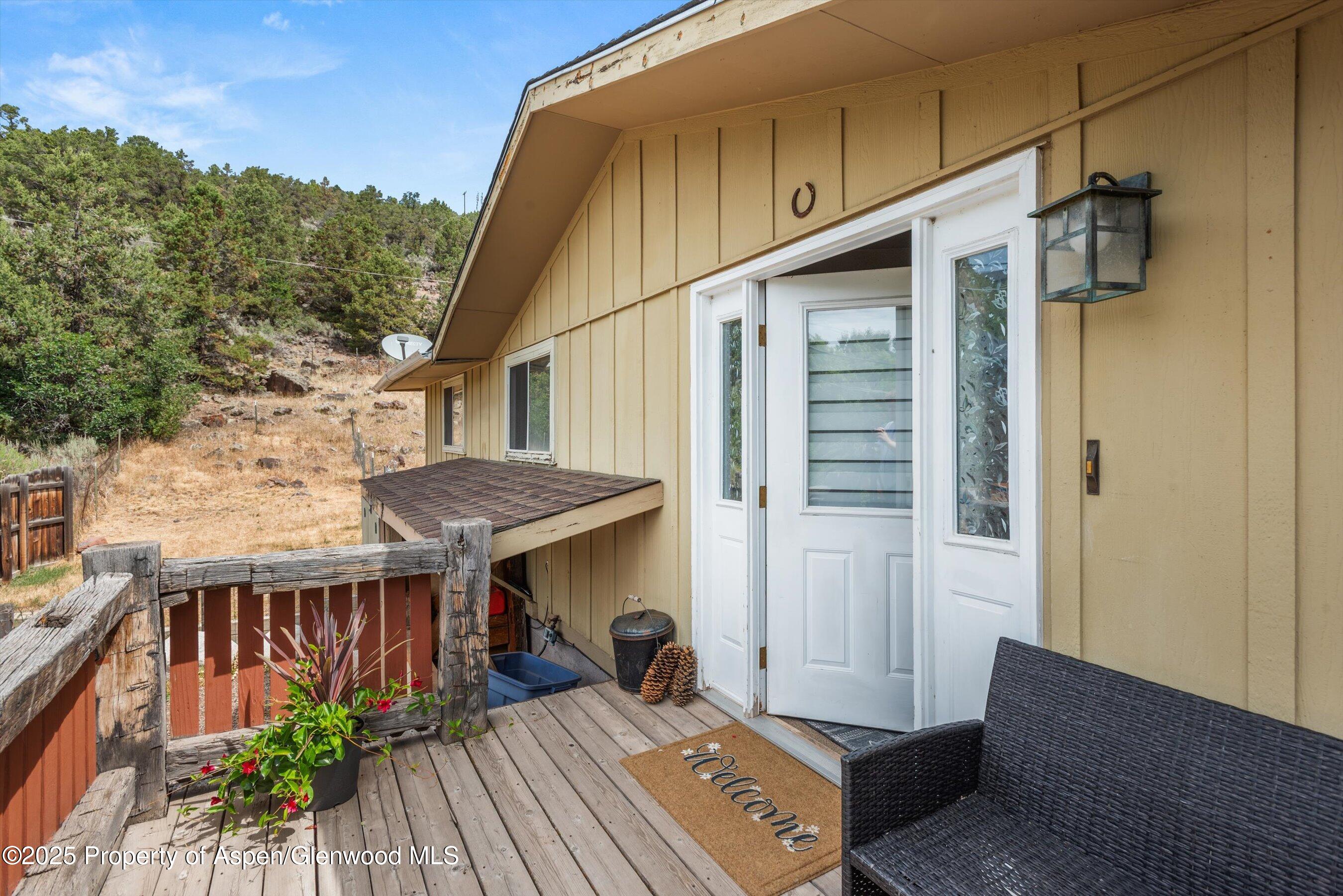 112 Hillside Drive Basalt, CO 81621 - Photo 15 of 28 a front view of house with yard outdoor seating and barbeque oven