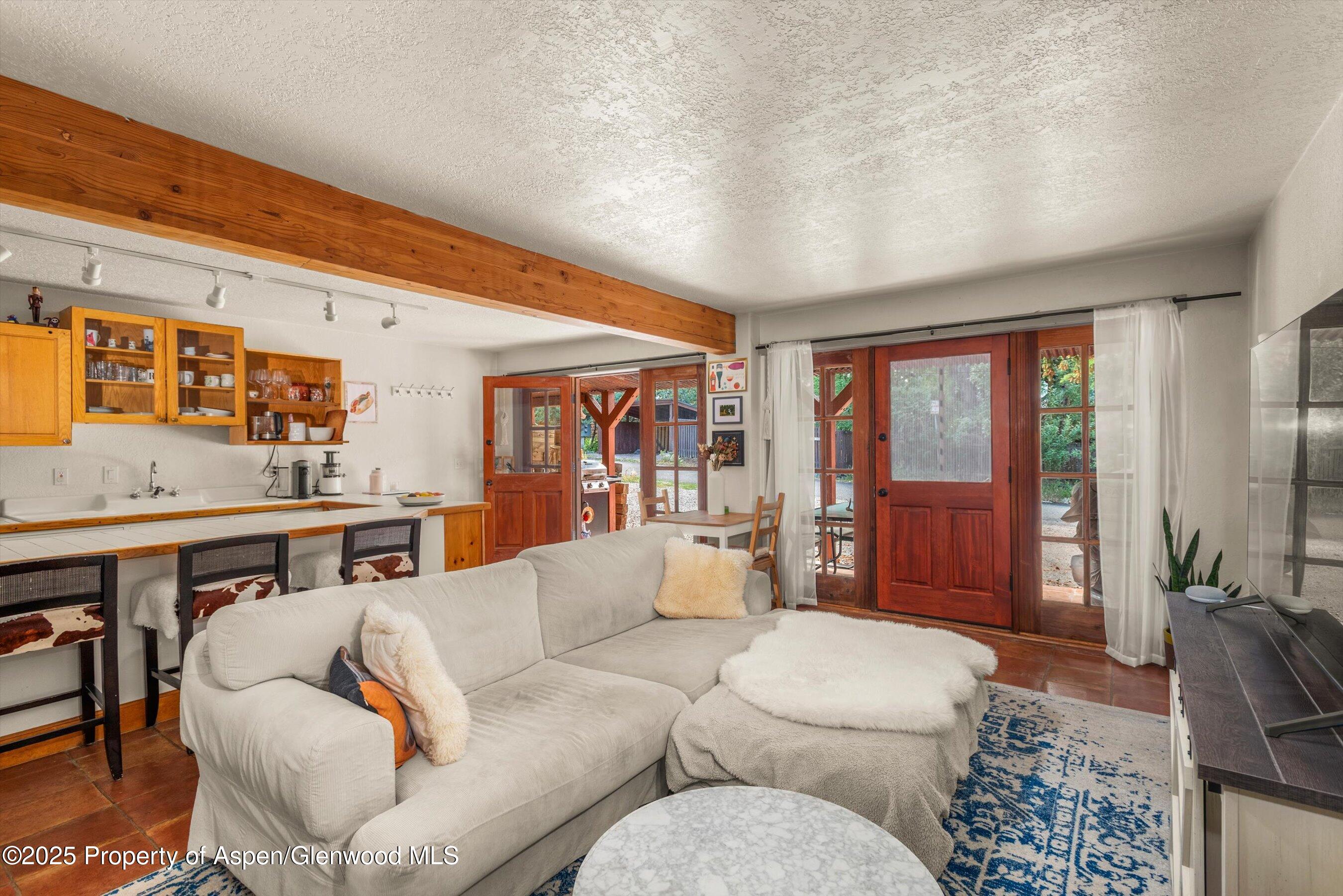 112 Hillside Drive Basalt, CO 81621 - Photo 17 of 28 a living room with furniture and a floor to ceiling window