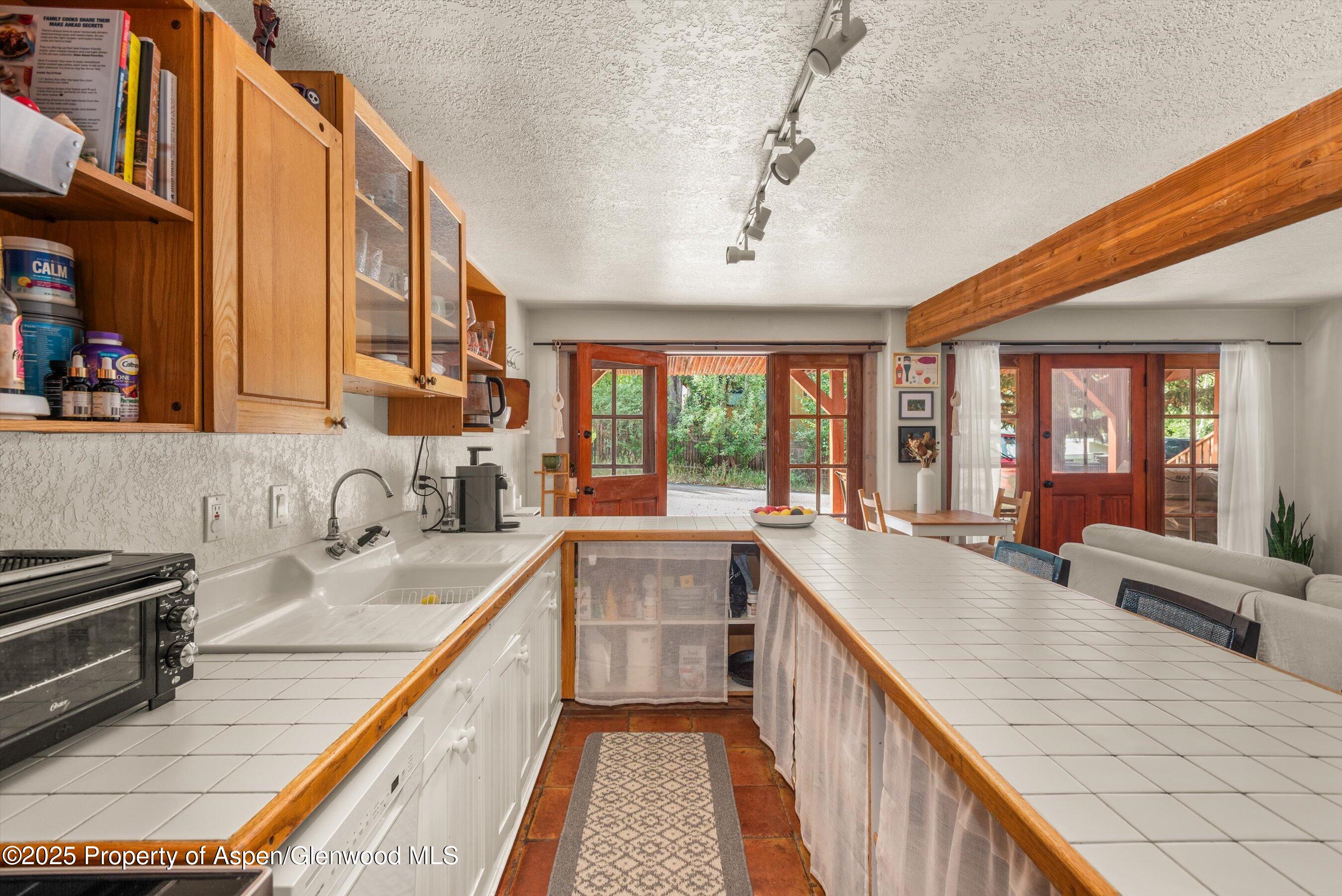 112 Hillside Drive Basalt, CO 81621 - Photo 20 of 28 a kitchen with sink a stove and cabinets