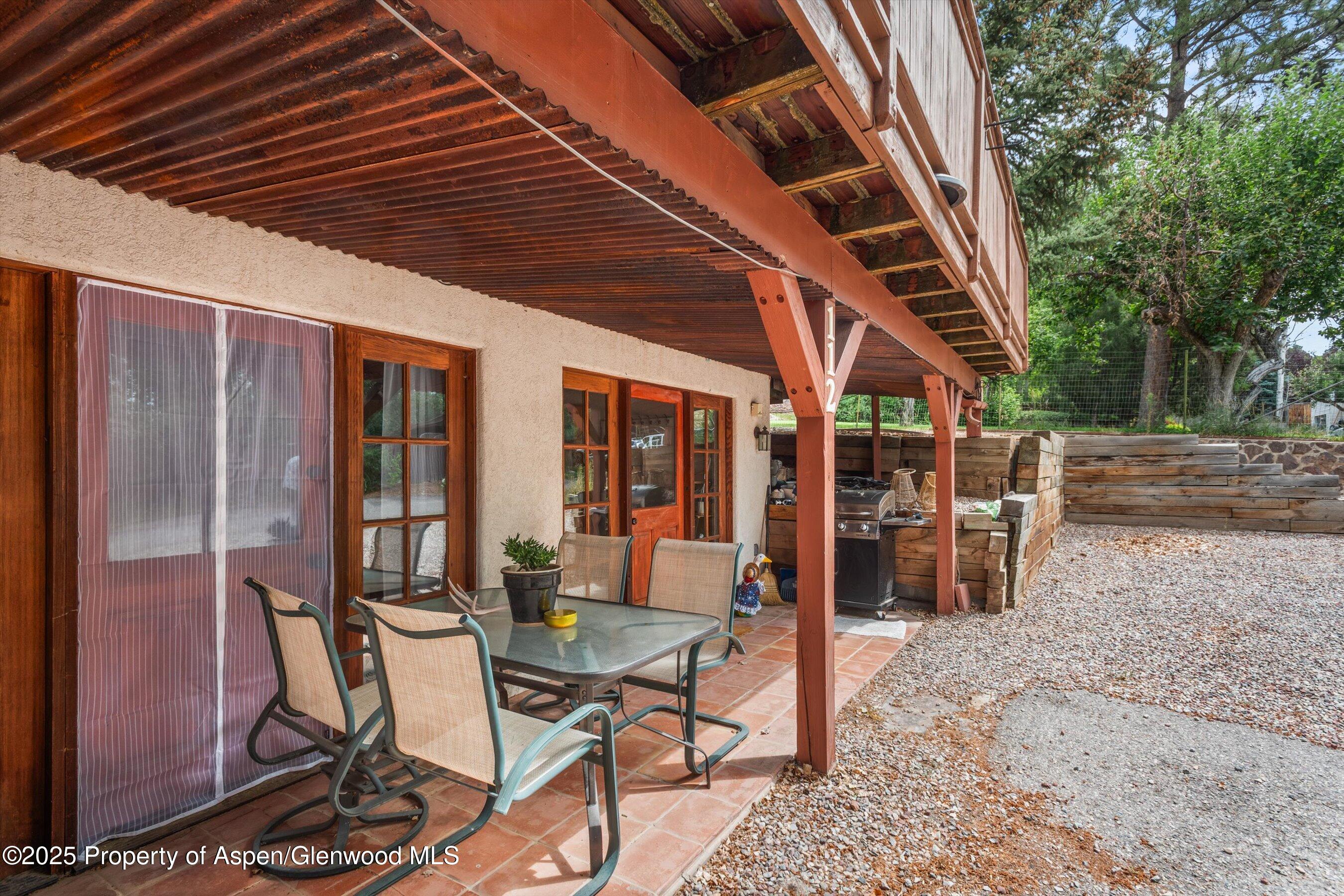 112 Hillside Drive Basalt, CO 81621 - Photo 23 of 28 a view of a patio with table and chairs and potted plants