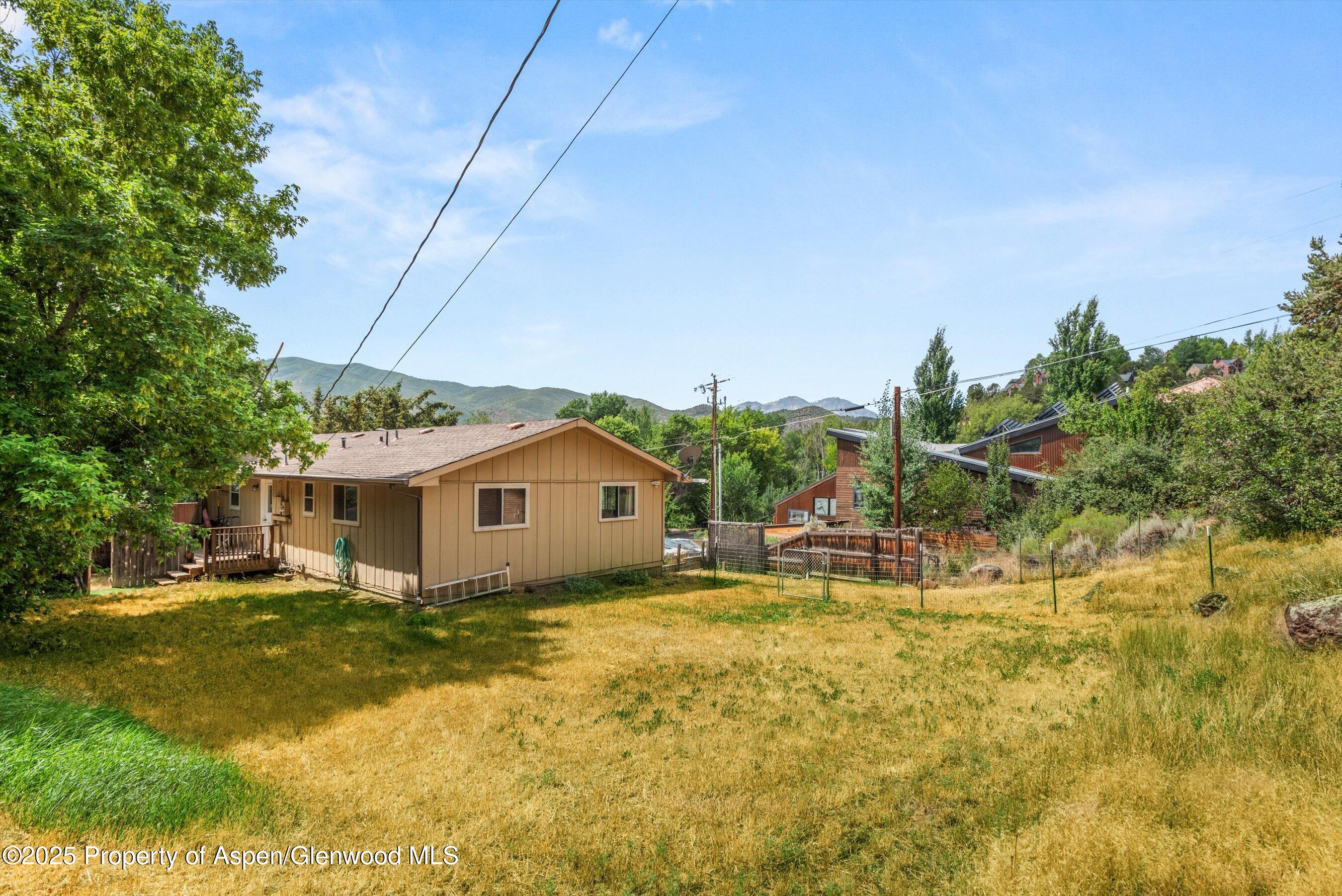 112 Hillside Drive Basalt, CO 81621 - Photo 25 of 28 a view of a house with a yard