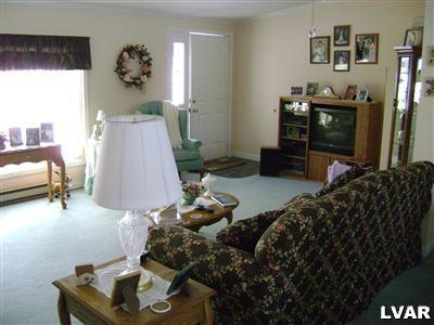 21 Winter Hill Road Effort, PA 18330 - Photo 2 of 5 a living room with furniture and a flat screen tv