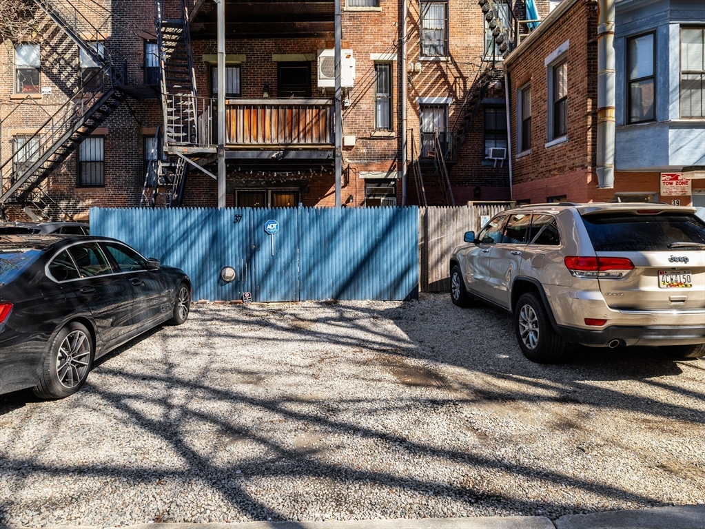 37 East Springfield Street, Unit 1 Boston, MA 02118 - Photo 16 of 18 a view of a cars park in front of a house