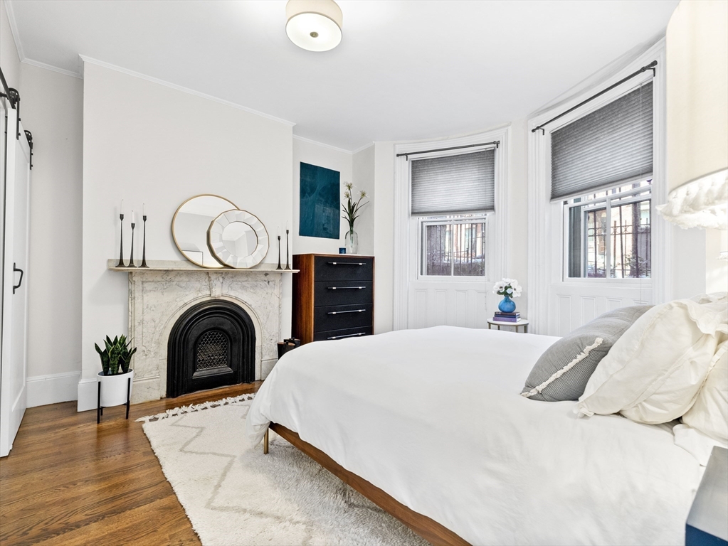 37 East Springfield Street, Unit 1 Boston, MA 02118 - Photo 2 of 18 a living room with furniture and a fireplace