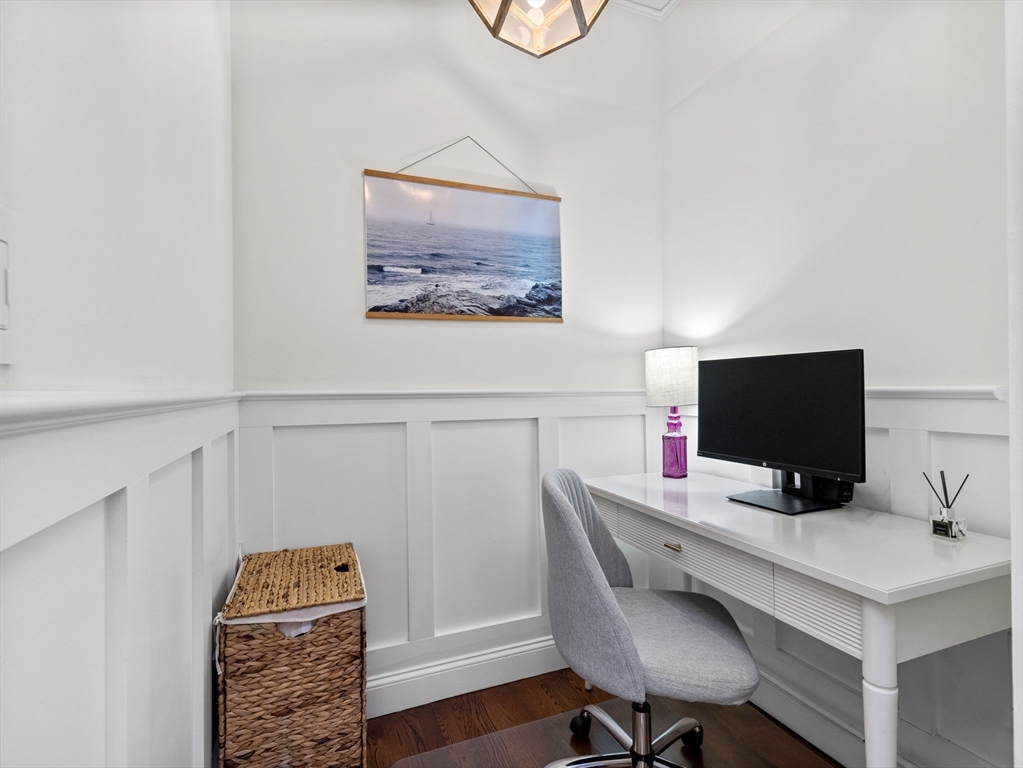 37 East Springfield Street, Unit 1 Boston, MA 02118 - Photo 5 of 18 a view of a workspace with furniture and wooden floor