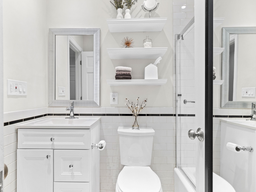 37 East Springfield Street, Unit 1 Boston, MA 02118 - Photo 6 of 18 a bathroom with a sink toilet and mirror