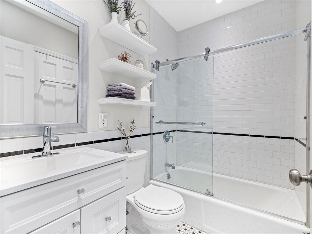 37 East Springfield Street, Unit 1 Boston, MA 02118 - Photo 7 of 18 a bathroom with a sink a mirror and a shower