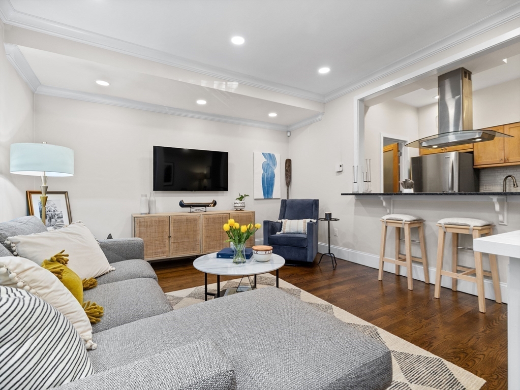 37 East Springfield Street, Unit 1 Boston, MA 02118 - Photo 8 of 18 a living room with furniture and a flat screen tv