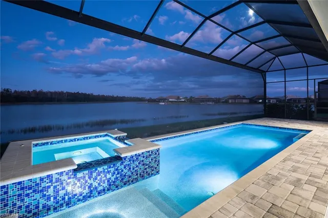 a utility room with granite countertop a sink a washer and dryer