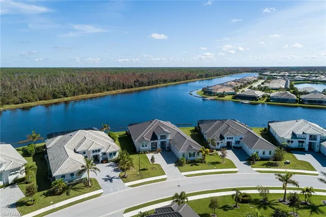 an aerial view of a house with a ocean view