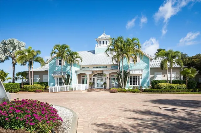 a view of a swimming pool with a table and chairs