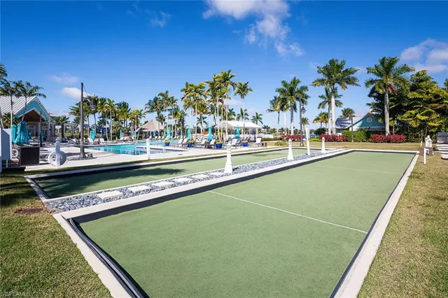 a view of swimming pool with a lounge chairs