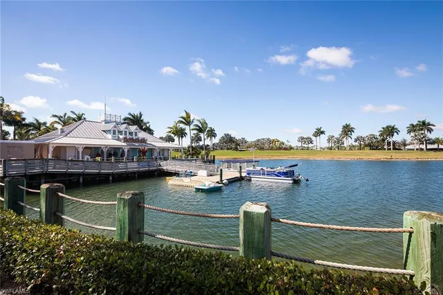 a view of a patio with lawn chairs