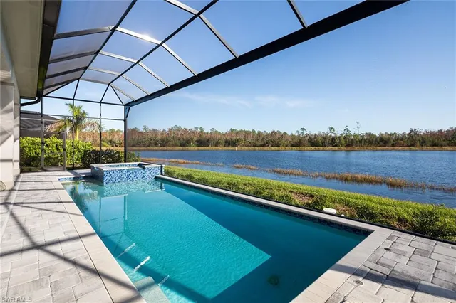 a view of swimming pool with outdoor seating and yard