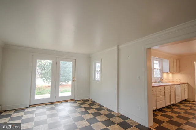 a view of a room with windows and dual sinks