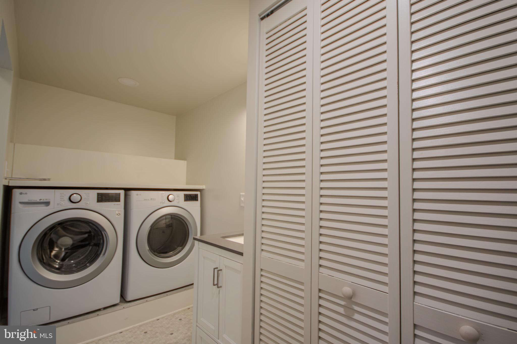 6817 Quantico Road Hebron, MD 21830 - Photo 17 of 39 a view of a bathroom with washing machine and dryer