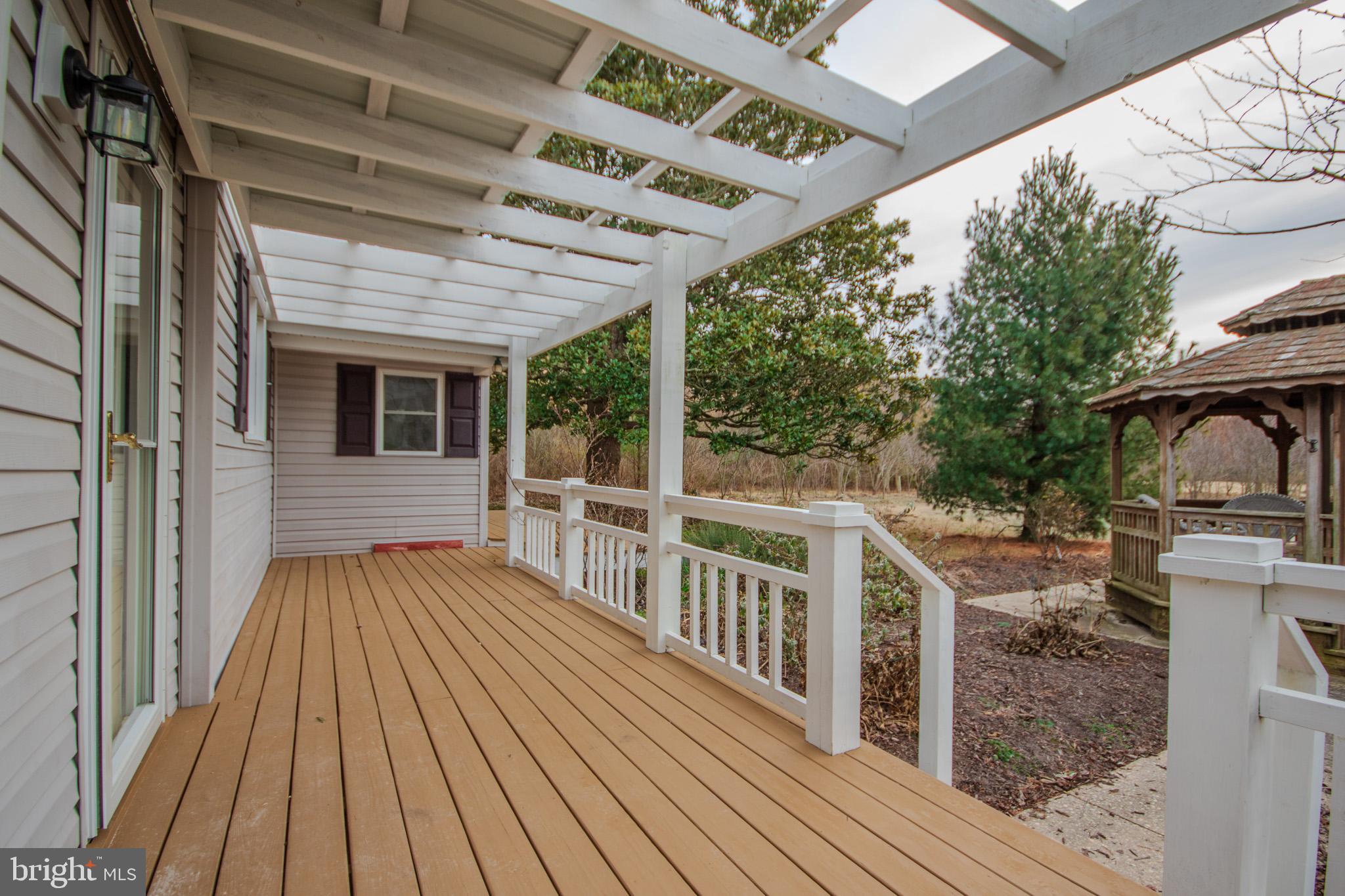 6817 Quantico Road Hebron, MD 21830 - Photo 29 of 39 a view of a house with wooden deck