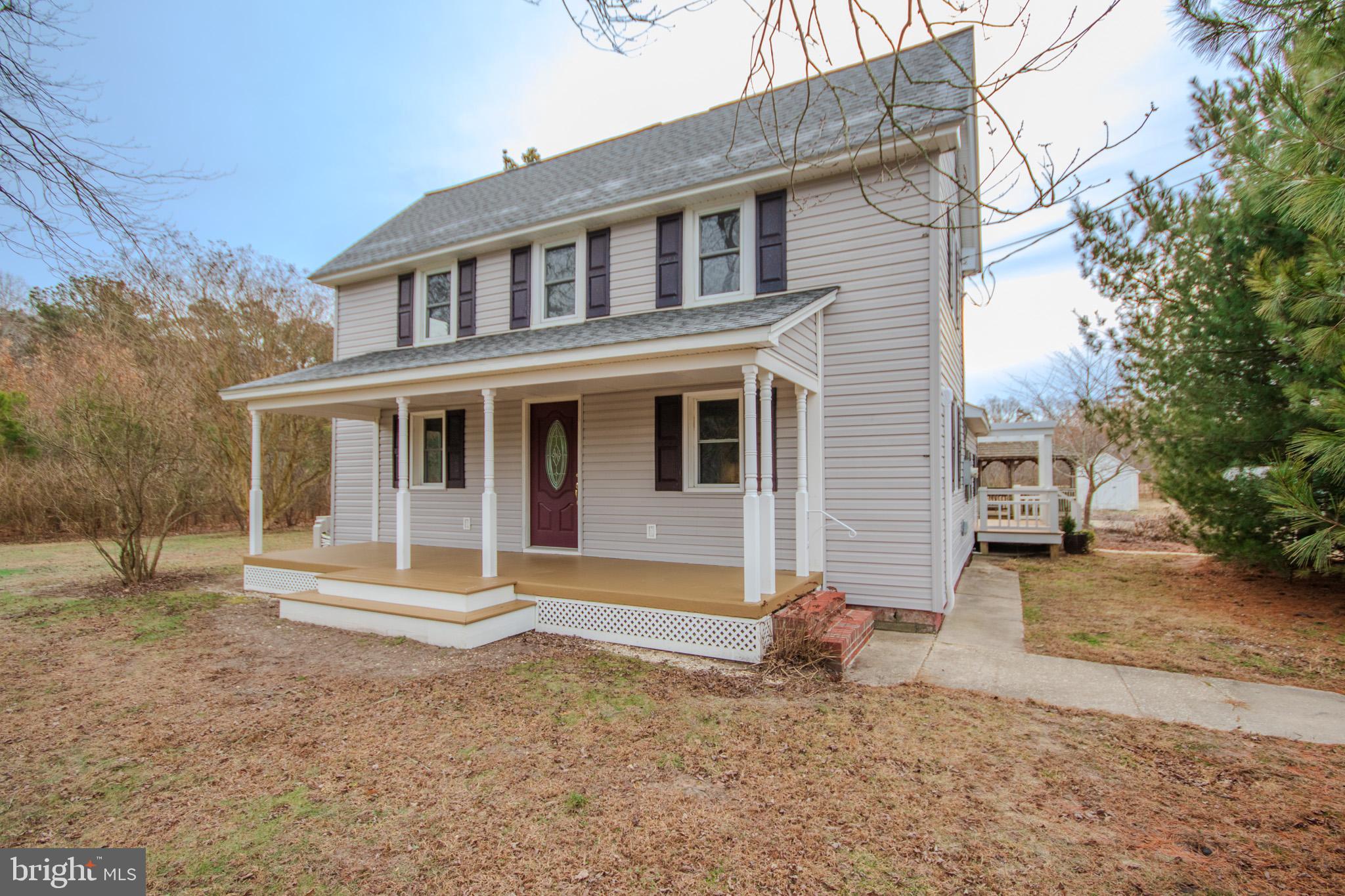 6817 Quantico Road Hebron, MD 21830 - Photo 3 of 39 a front view of a house with a yard