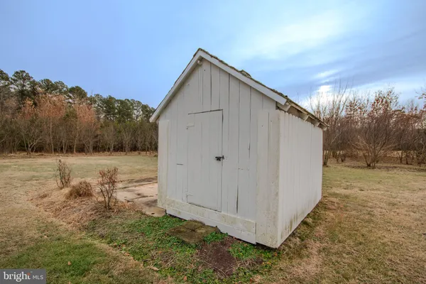 a view of a house with a yard and a garage