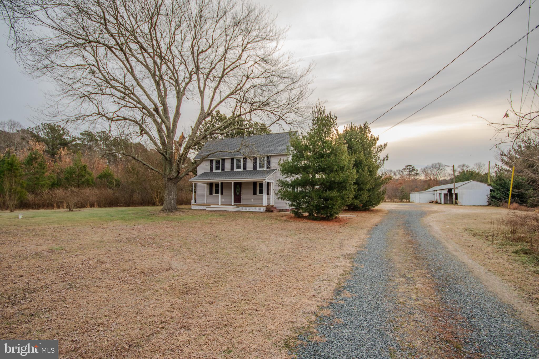 6817 Quantico Road Hebron, MD 21830 - Photo 4 of 39 a view of a house with a yard and garage