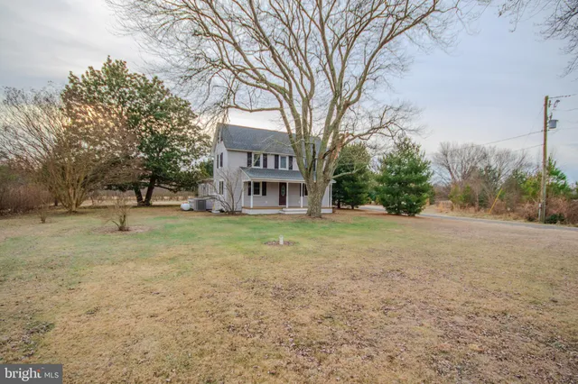 a view of house with outdoor space and trees