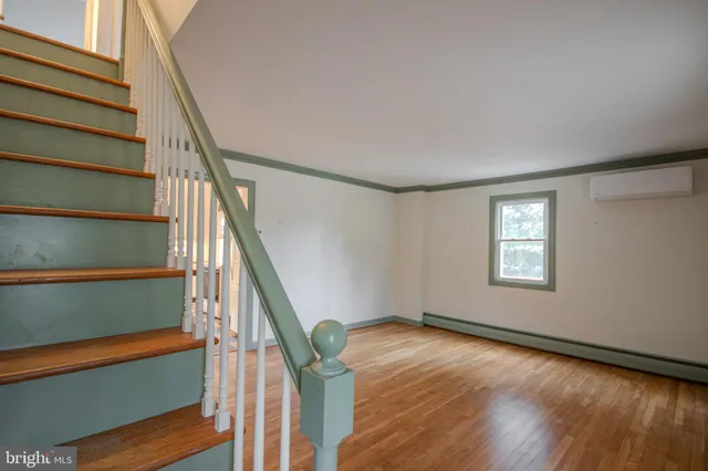 a view of entryway with wooden floor
