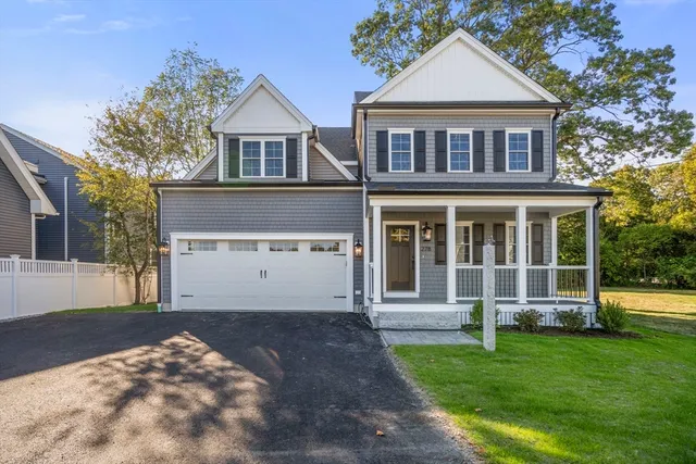 front view of a house with a yard