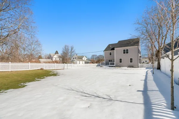 a view of a a dining room with furniture window and wooden floor