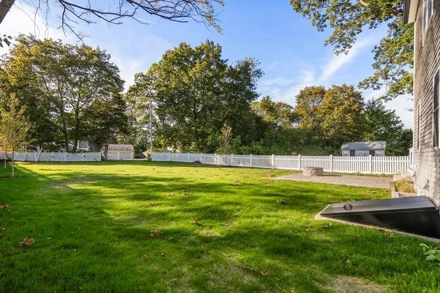 a view of a swimming pool with a yard
