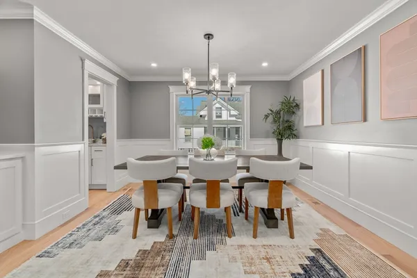 a spacious bedroom with a bed a couch and a window