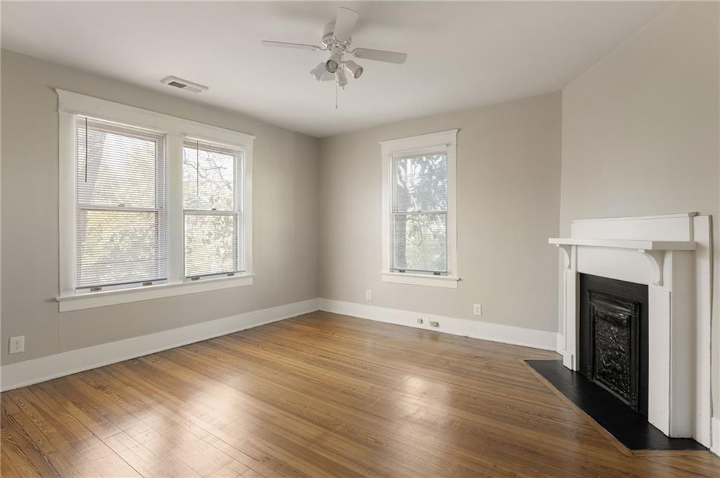 120 South Candler Street Decatur, GA 30030 - Photo 22 of 40 a view of an empty room with wooden floor and a window
