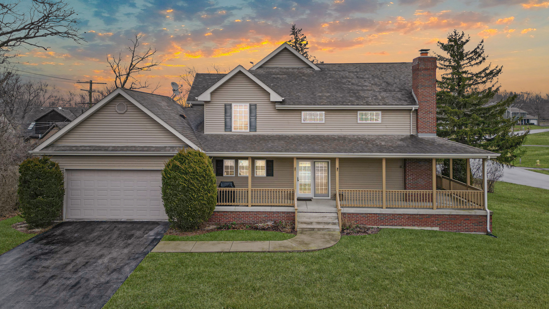 a front view of a house with a yard