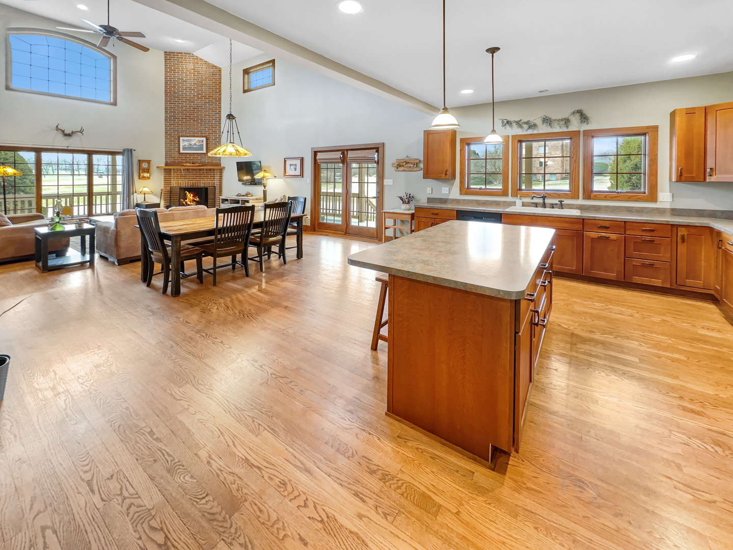493 Aberdeen Drive Crete, IL 60417 - Photo 11 of 52 a living room with couches and kitchen view with wooden floor