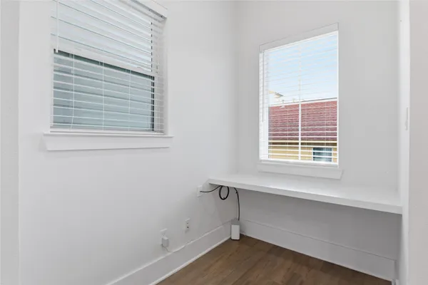 a bathroom with a sink vanity mirror and toilet