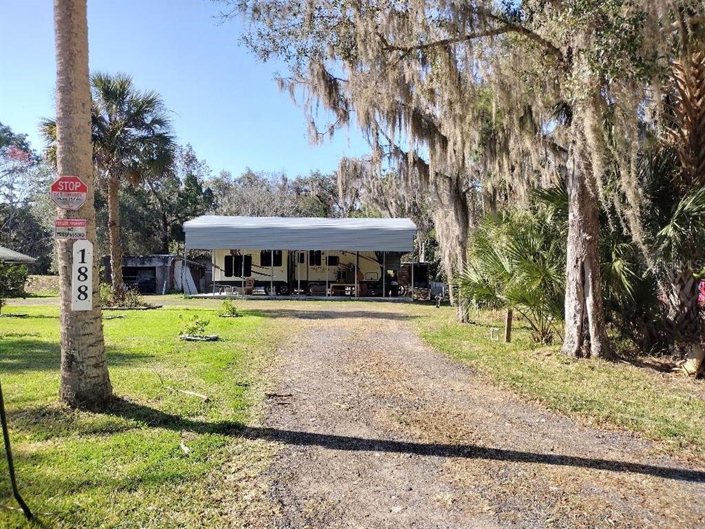 188 Canham Street Bunnell, FL 32110 - Photo 1 of 4 a view of a house with a yard