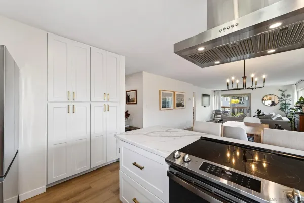 a kitchen with a stove and cabinets