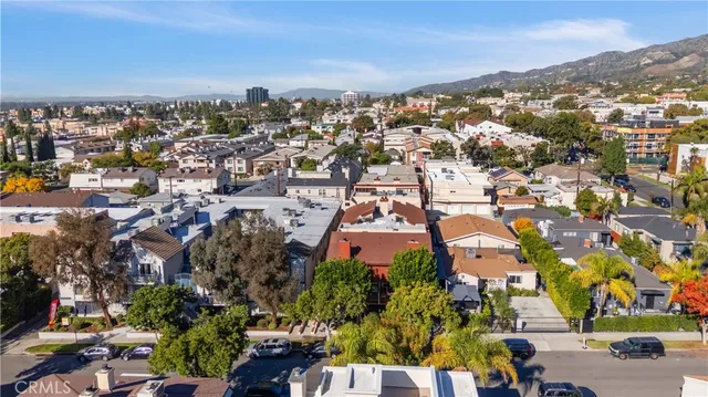 a front view of a building with tree s