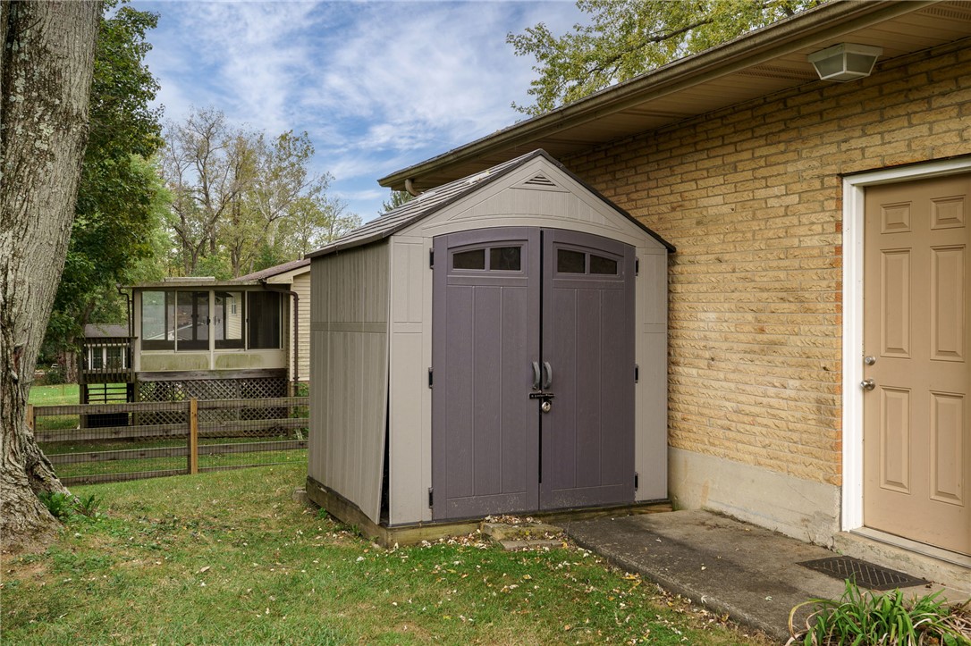 6950 Red Lion 5 Points Road Springboro, OH 45066 - Photo 56 of 78 This charming outdoor area features a convenient storage shed and access to a sunroom.