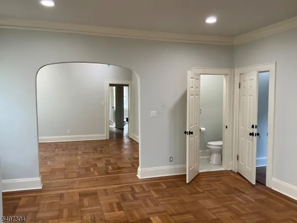 workspace with wooden floor and mirror
