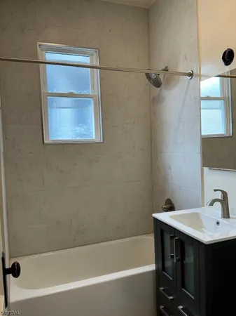 a bathroom with a sink and a bathtub