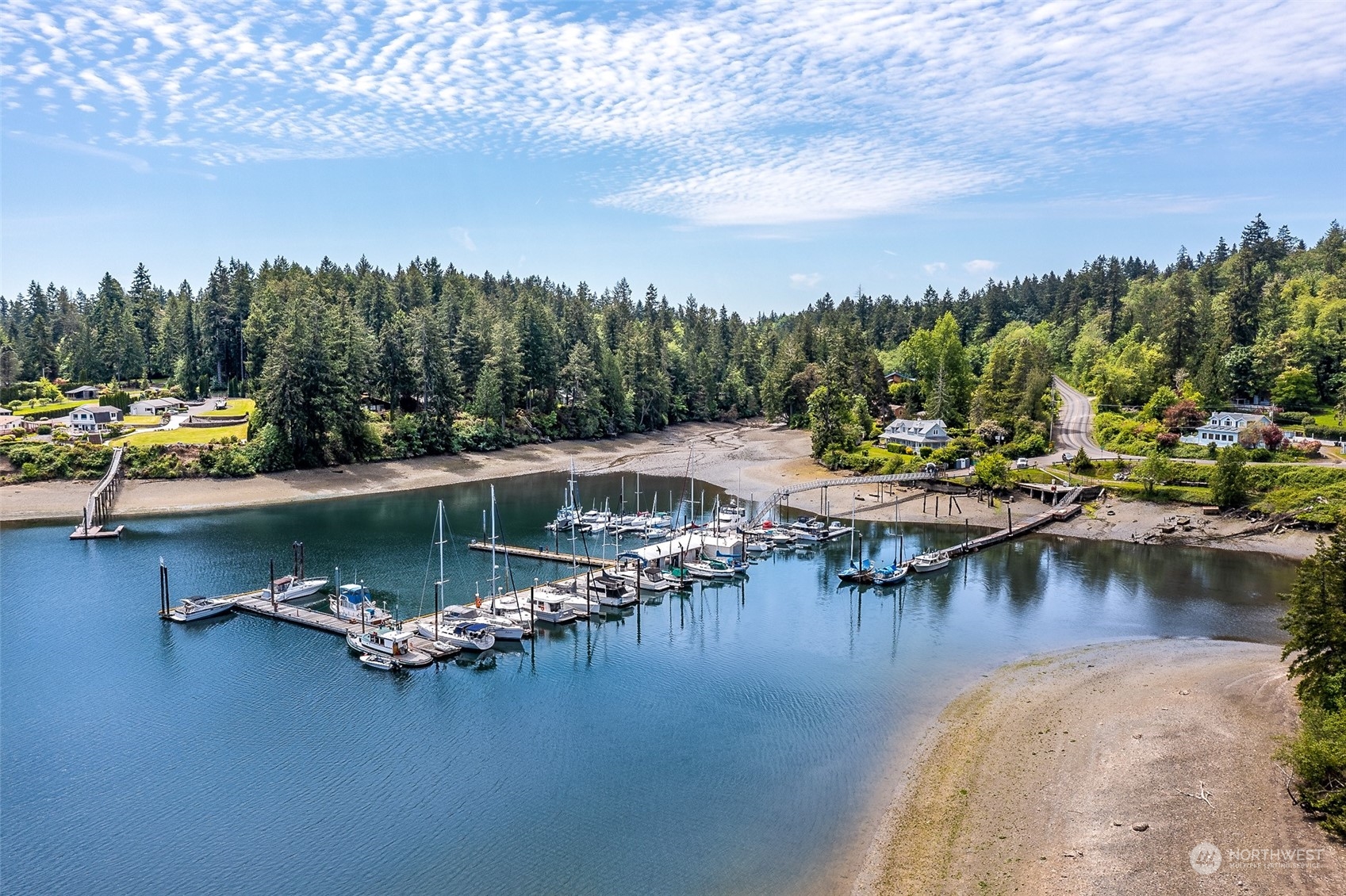 5006 165th Avenue Southwest Longbranch, WA 98351 - Photo 2 of 11 a view of a lake with boats and trees all around